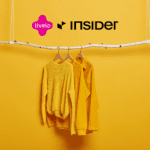 cabide de roupas amarelas com logo Livelo Insider
