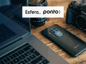 mesa com notebook e celular com logo Esfera e ponto 9 pontos Esfera