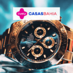 relógio dourado com logo Livelo e Casas Bahia