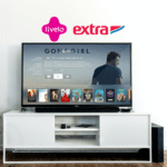 televisão em uma sala com logo Livelo e Extra 6 pontos Livelo