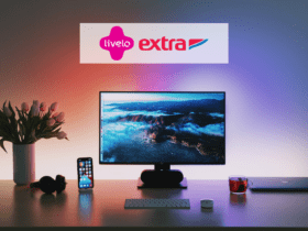 mesa com monitor e celular com logo Livelo e Extra 9 pontos Livelo