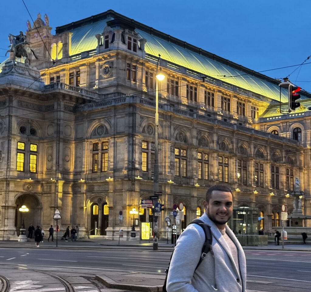 homem sorridente em Viena, Áustria  Como fazer Open Jaw